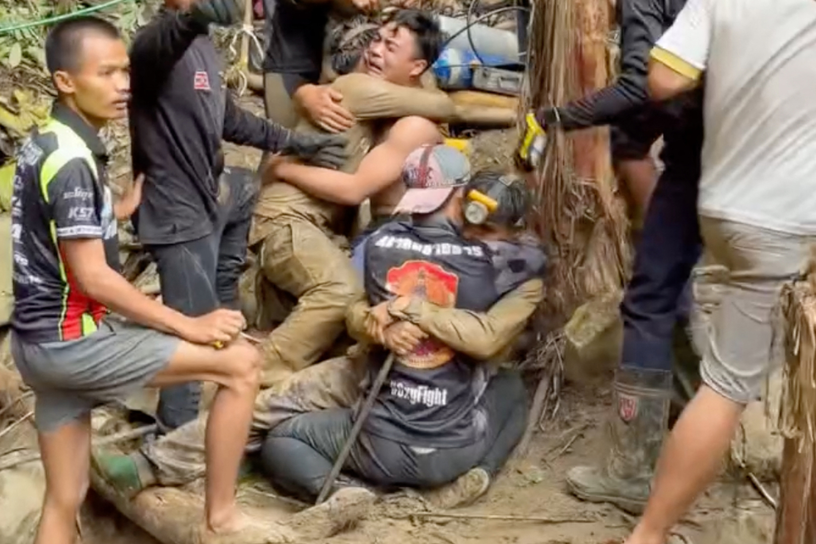 Video thumbnail for Emotional scenes as more survivors pulled from flooded Laos cave