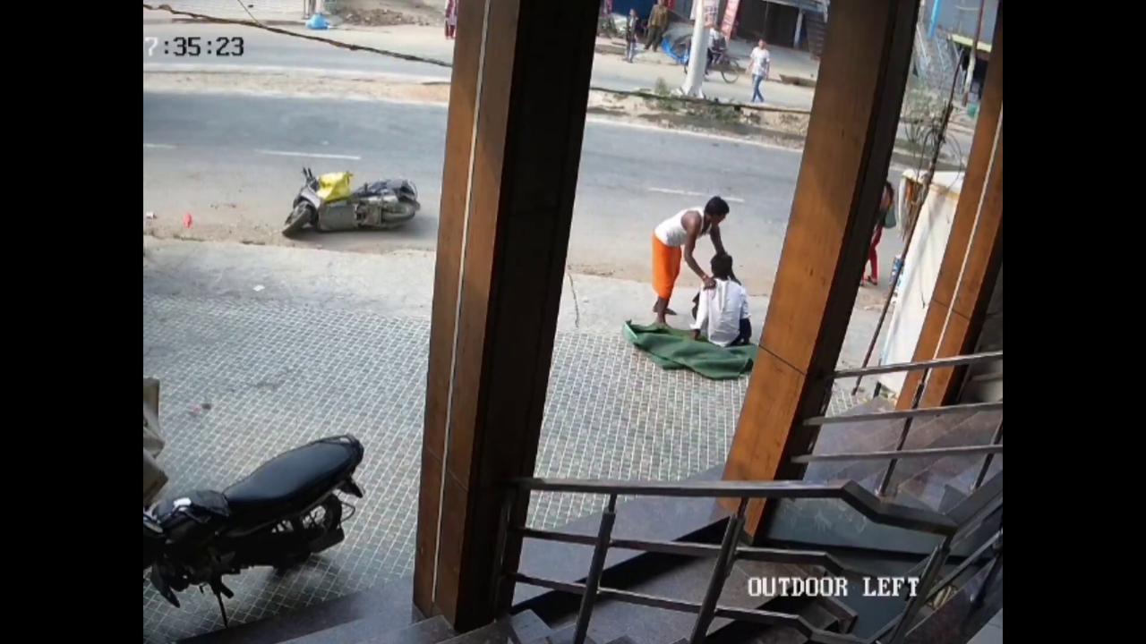 Video thumbnail for India: Scooter rider survives near-fatal collision with trailer.