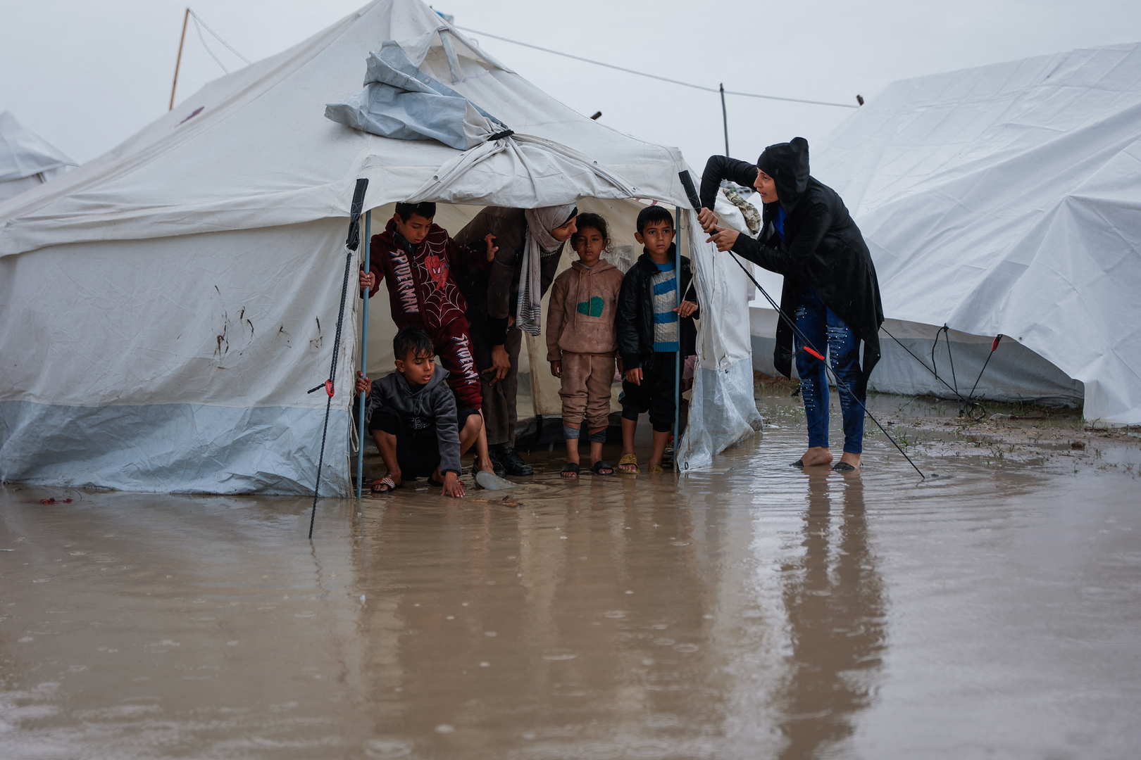 Video thumbnail for Desperate children in Gaza try to keep floodwater out of tents
