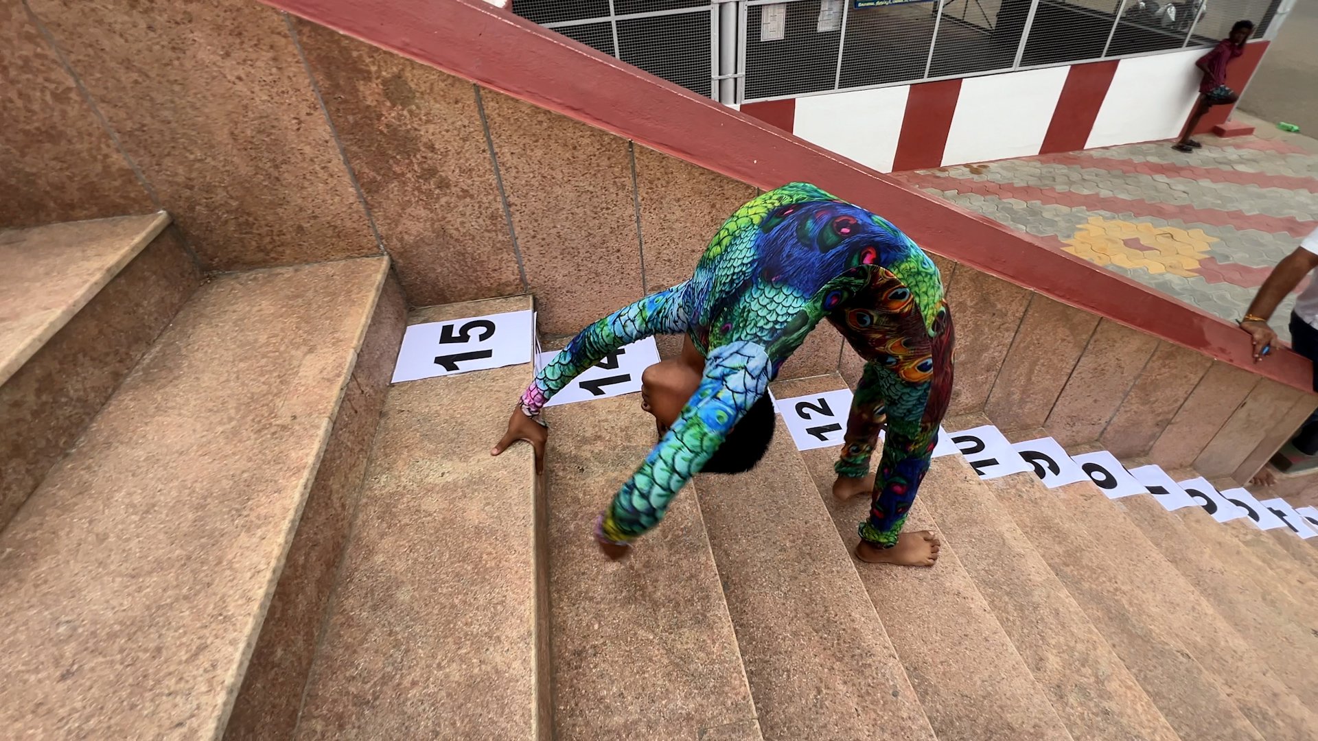 Video thumbnail for Fastest time to ascend and descend 15 stairs in a back bend position - 41.01 seconds by P K Saishriguru