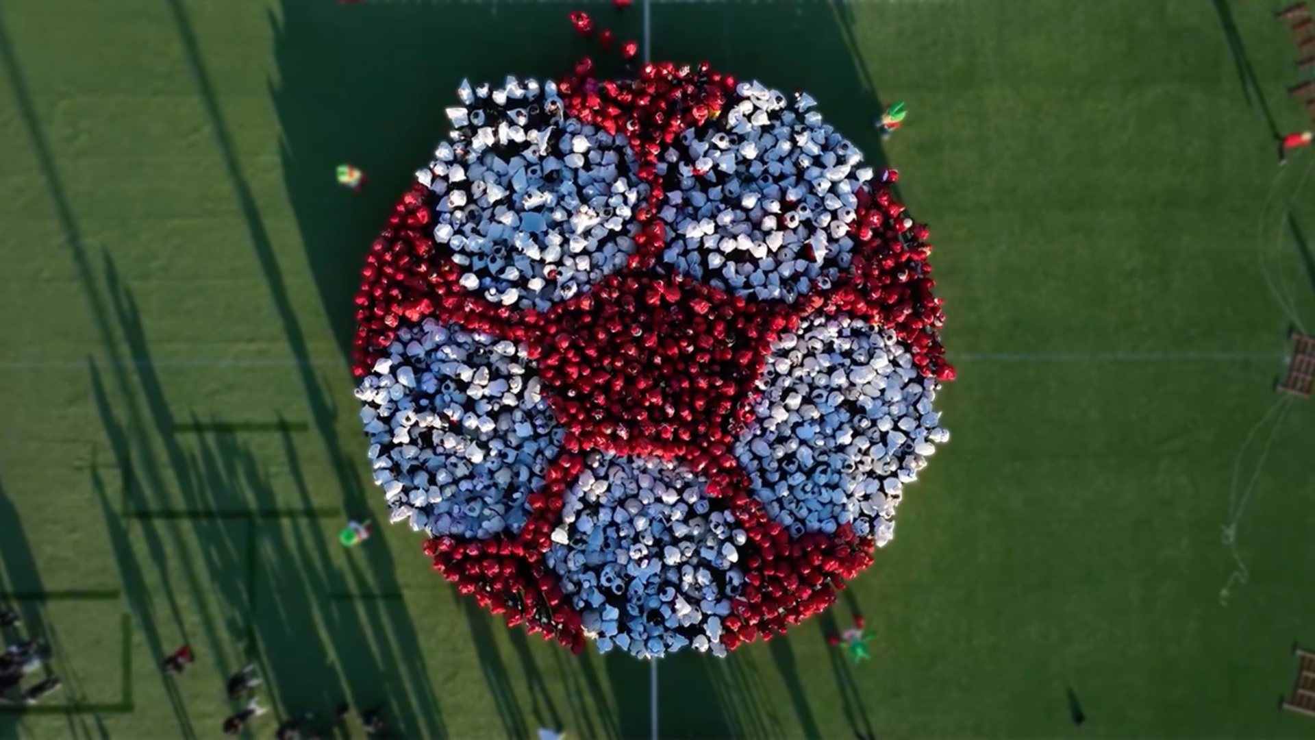 Video thumbnail for Largest human image of a football (soccer ball)  1,198 people by RedsLand