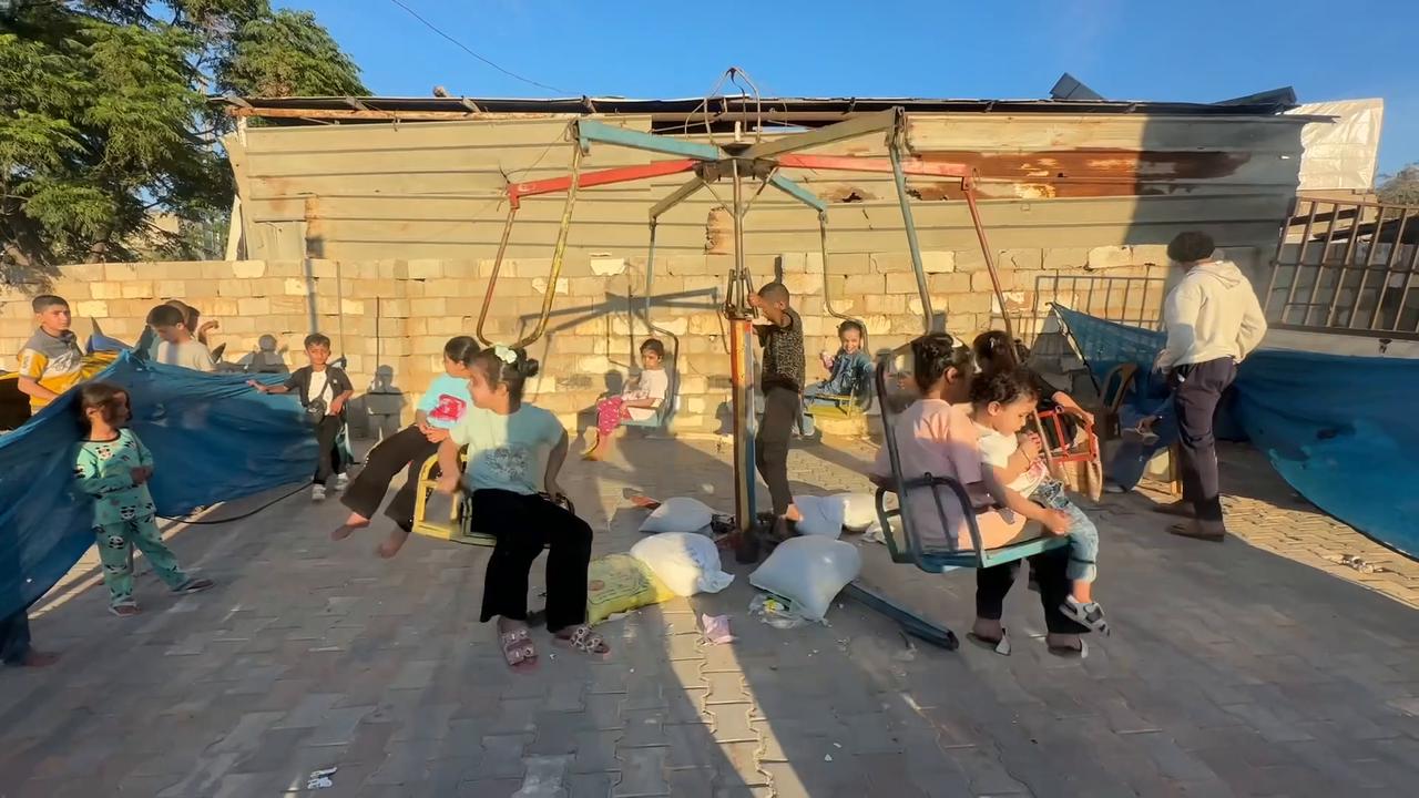 Video thumbnail for Mobile amusement park offers brief Eid joy to children in Gaza's Nuseirat Camp.