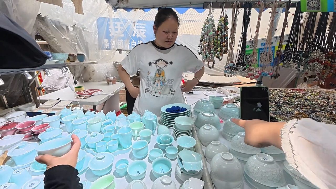 Video thumbnail for Woman demonstrates musical ceramic bowl in Jiangxi, China