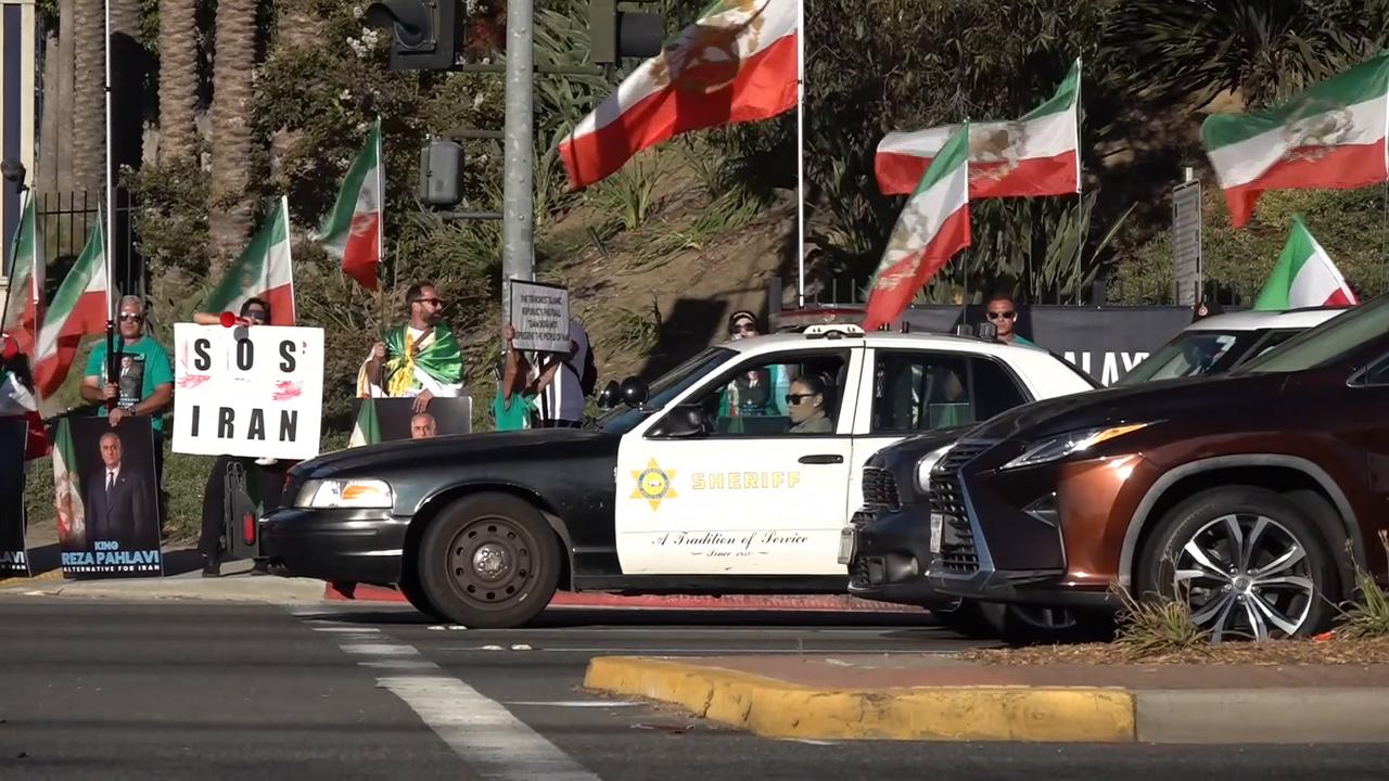Video thumbnail for US: Protesters gather outside hotel hosting Iran national football team ahead of Belgium World Cup match.