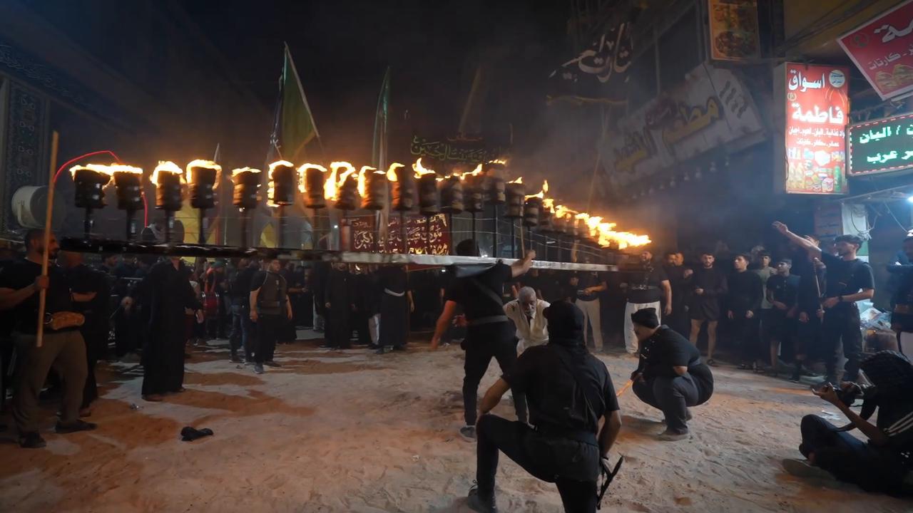 Video thumbnail for Iraq: Shia Muslims hold torchlight procession in Iraq during Muharram commemorations.