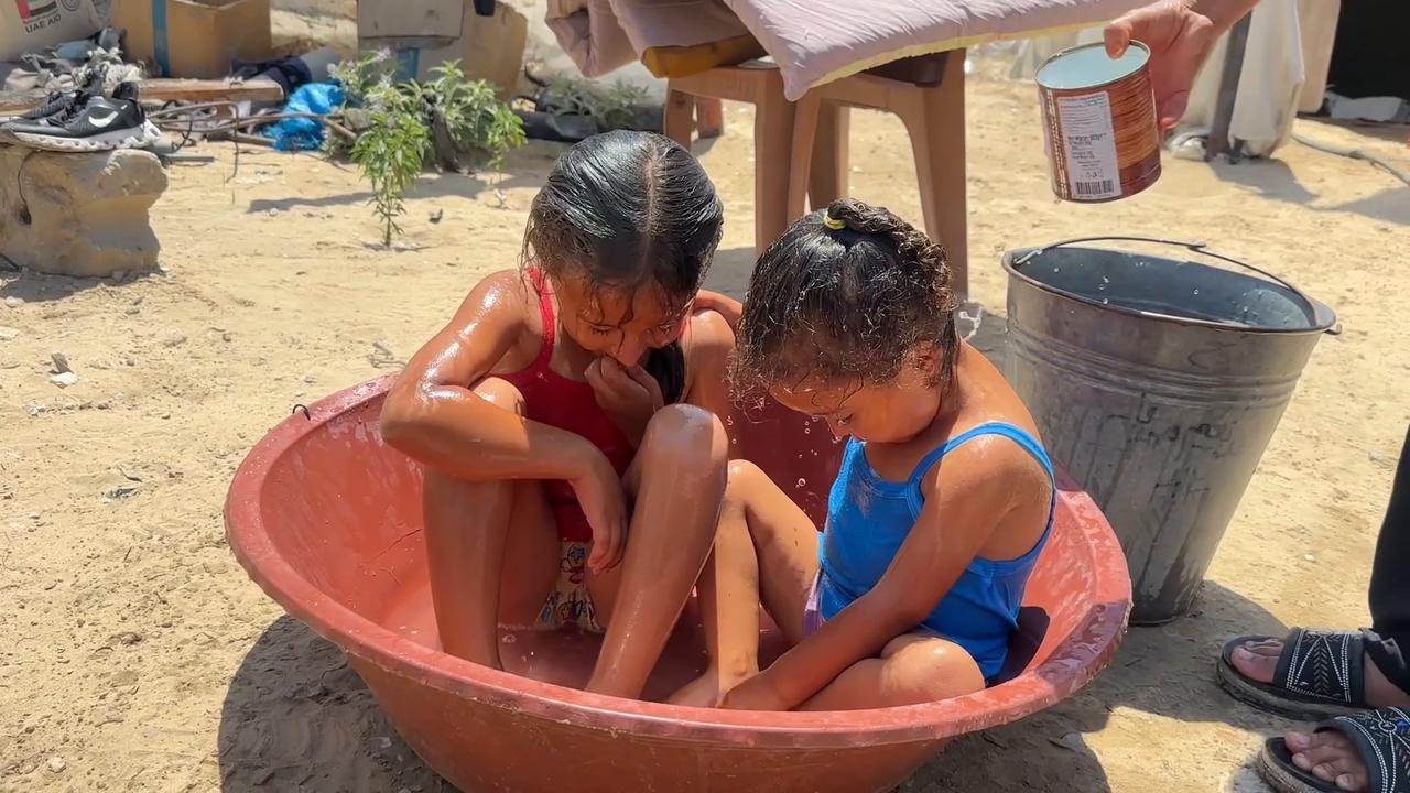 Video thumbnail for Displaced families in Gaza struggle with heat, hunger and water shortages under Israeli blockade.