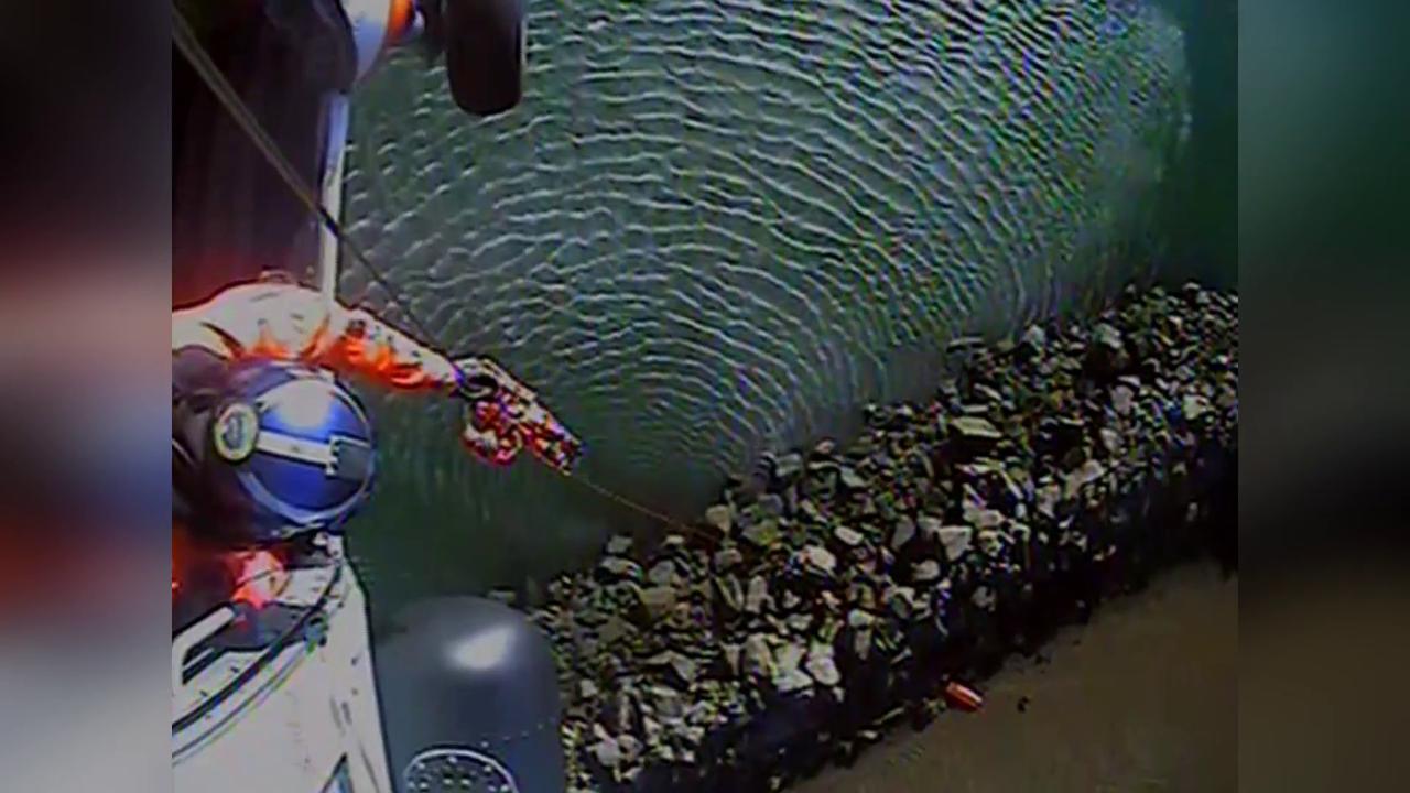 Video thumbnail for US: Coast Guard Helicopter Hoists Injured Man Trapped Under Rock At Oregon Marina.