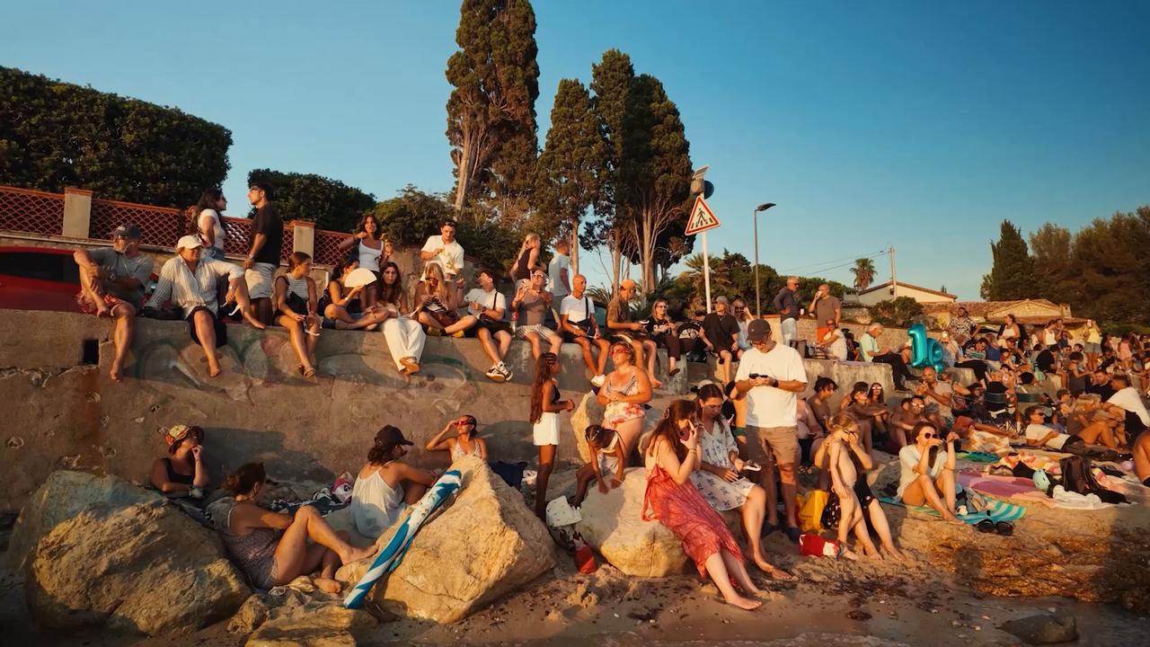 Video thumbnail for France: Beachgoers gather in southeastern France to watch solar eclipse.
