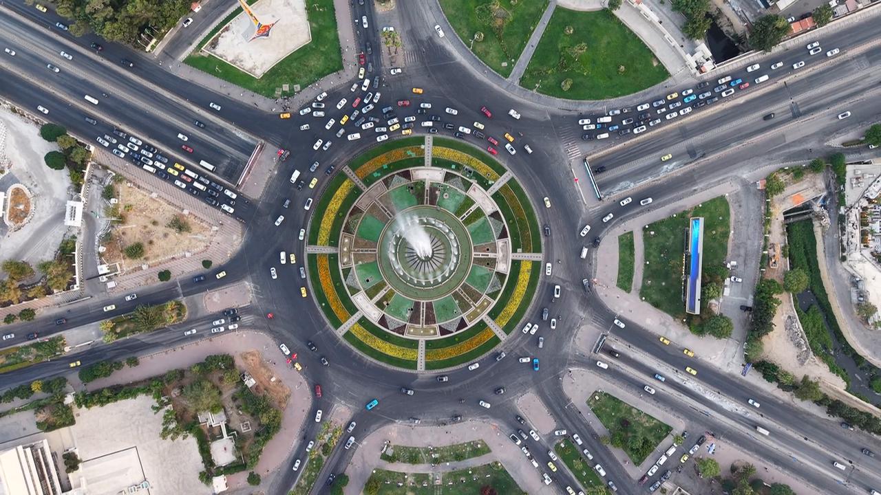 Video thumbnail for Syria: Aerial Drone View of Umayyad Square in Damascus Featuring Massive Syrian Flag at Sunset.