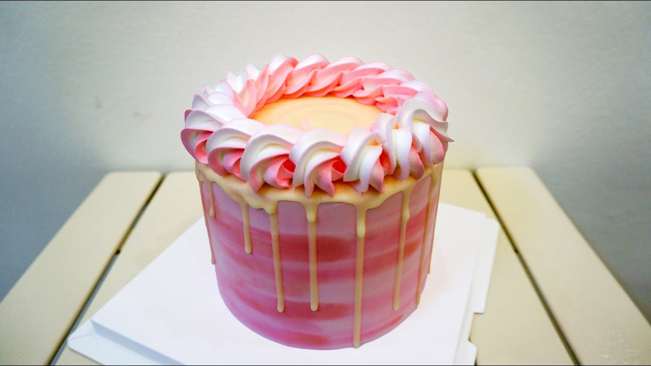 'Video thumbnail for Birthday cake is cleverly filled with cream, decorated with pink flowers'