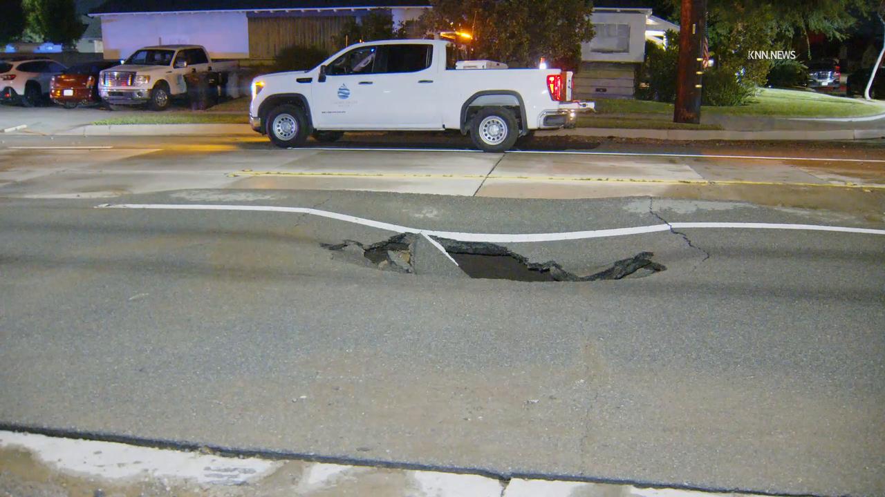 Video thumbnail for US, Los Angeles: Covina Water Main Break Causes Large Sink Hole.
