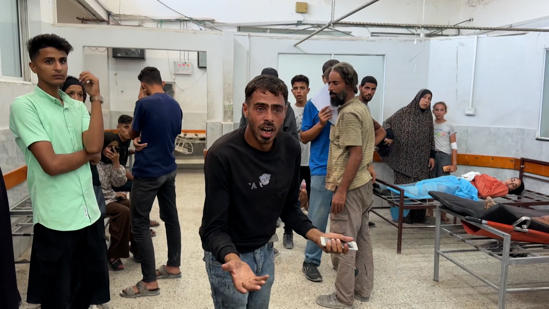 'Video thumbnail for Palestinian man searches for child as Al Jazeera reports from Gaza hospital'