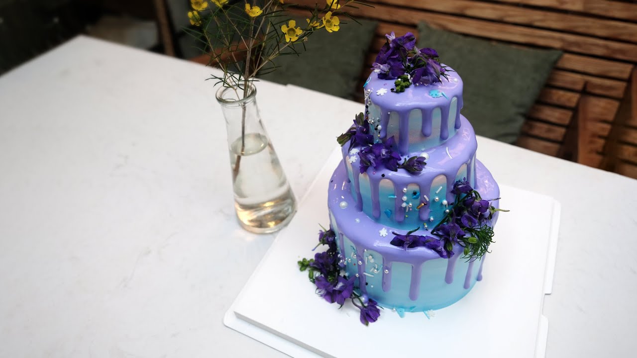 'Video thumbnail for Wedding Cake Three Level filled with purple cream and flowers for our celebration'