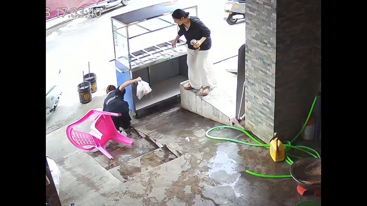 Video thumbnail for Woman Wobbles and Falls as Chair Slips on Pavement in China
