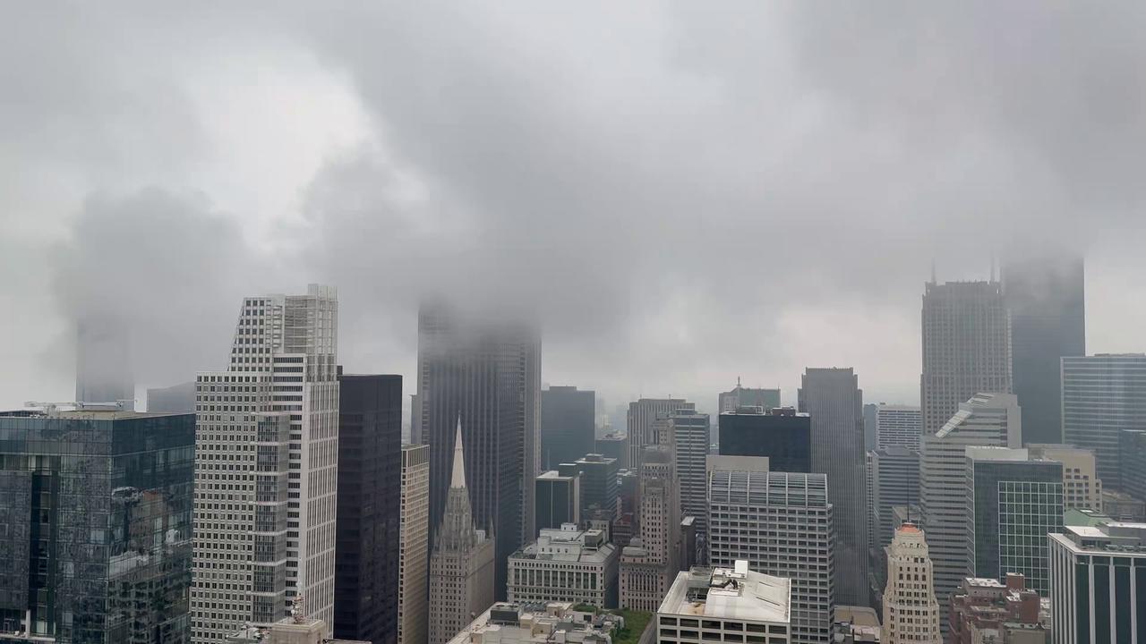 Video thumbnail for US: Skyscraper Tops Disappear Into Storm Clouds Over Chicago.