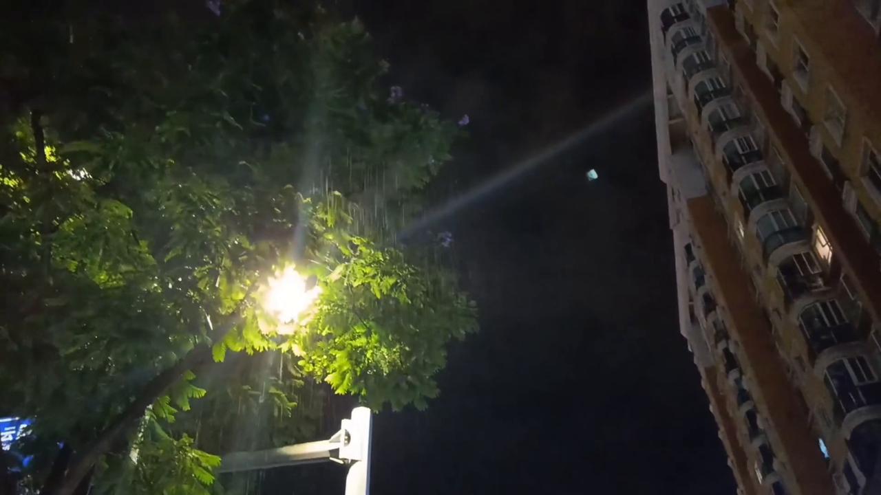 Video thumbnail for China: Tiny rain cloud soaks blind path on Chinese street while nearby ground stays dry.