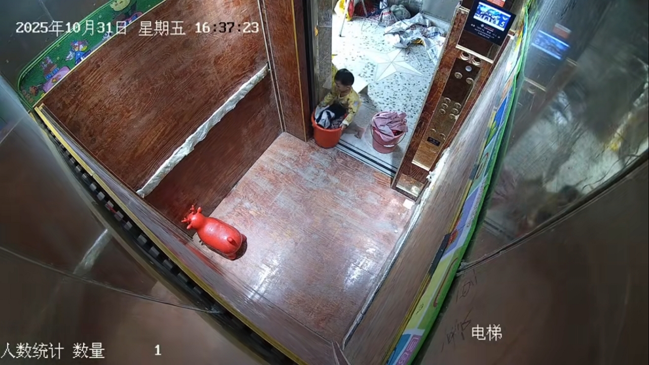 Video thumbnail for Child assists with laundry using elevator in Guangdong, China