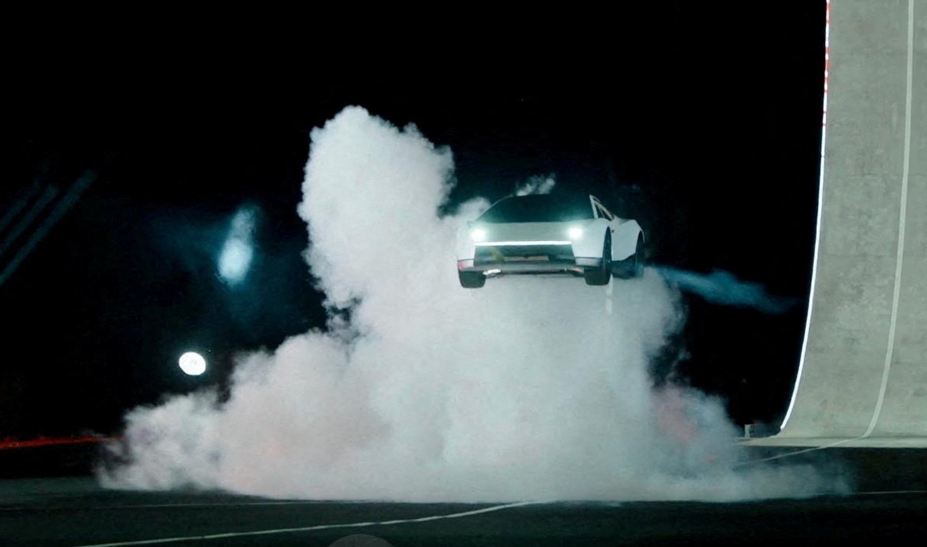 Video thumbnail for Tesla unveils car that can drive upside down and jump through the air