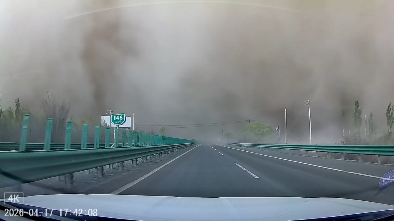 Video thumbnail for Driver navigates through a massive dust storm on Xinjiang highway