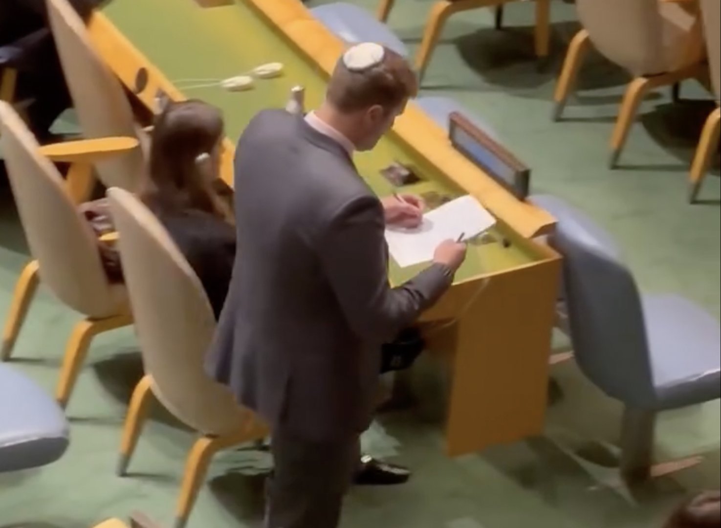 Video thumbnail for Israeli official takes notes after UN walkout against Netanyahu