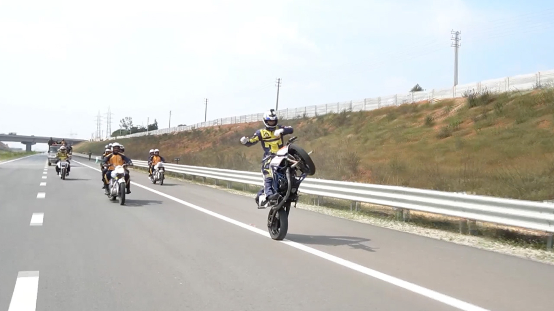 'Video thumbnail for Stunt rider performs one mile long no-handed motorcycle wheelie'