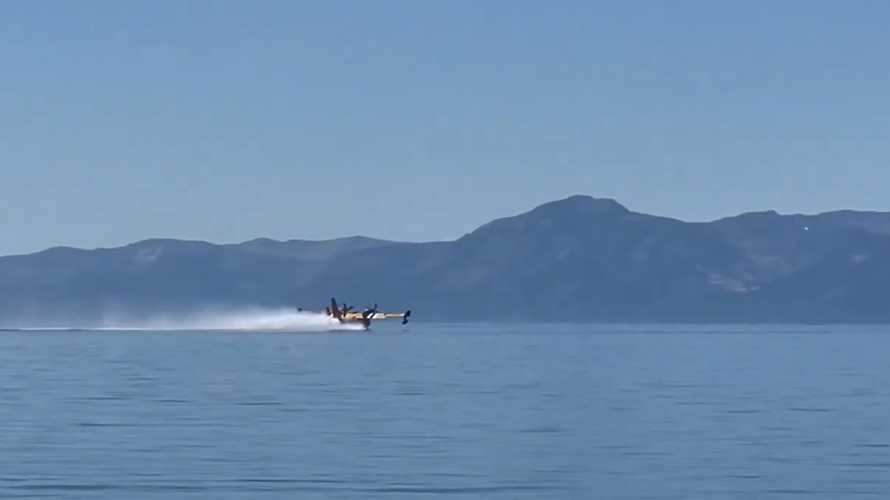 Video thumbnail for Plane Scoops Water From Cedar Beach to Fight the Davis Fire in Nevada