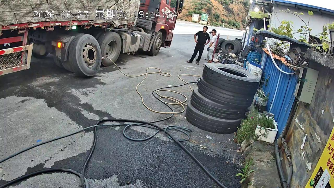 Video thumbnail for China: Chinese truck tire blows up seconds after workers hear warning sound.