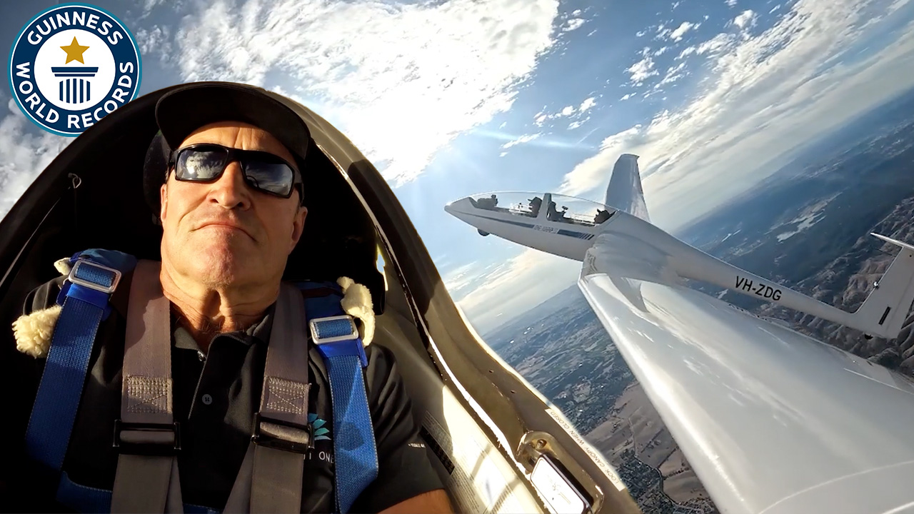 'Video thumbnail for Father and son perform most loops in an airborne glider'