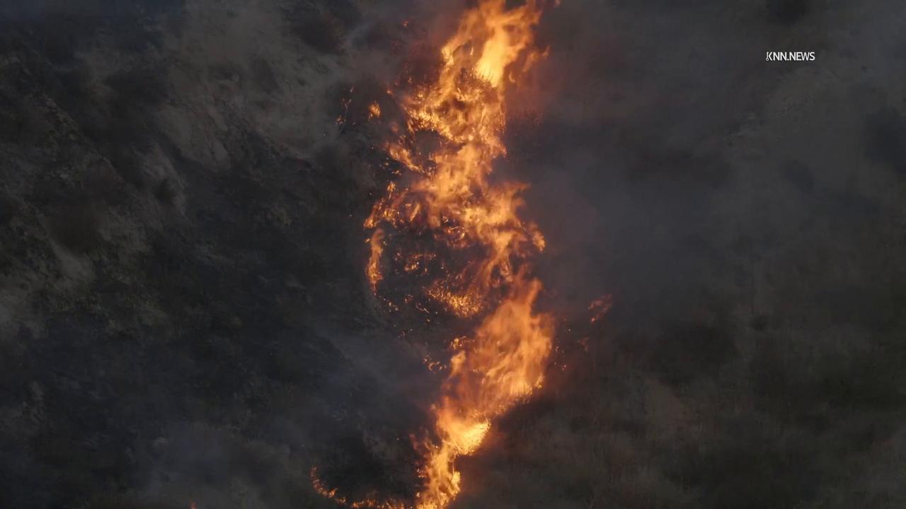 Video thumbnail for US, Los Angeles: Valencia Firefighters Battle Brush Fire Below Power Lines.