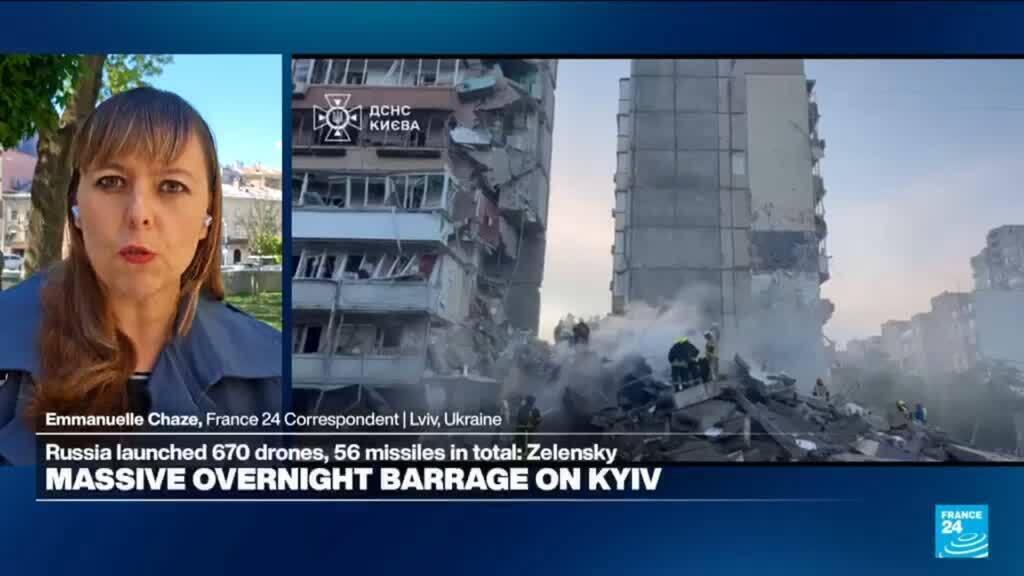 Video thumbnail for A massive overnight barrage on Kyiv splits a residential building in two