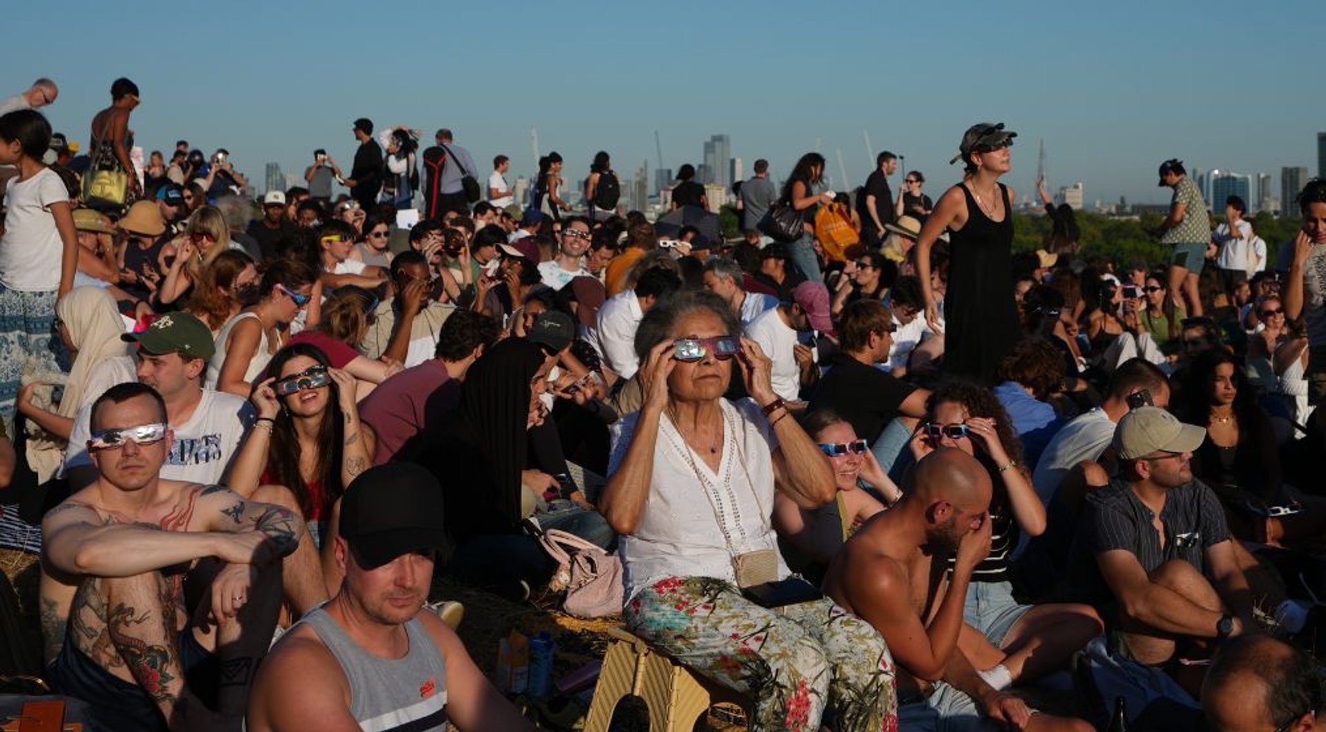 Video thumbnail for Thousands gather in London to watch rare partial solar eclipse