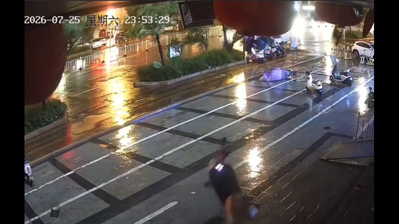 Video thumbnail for China: Electric scooter suspended by strong winds as Typhoon Hongxia hits Guangdong.