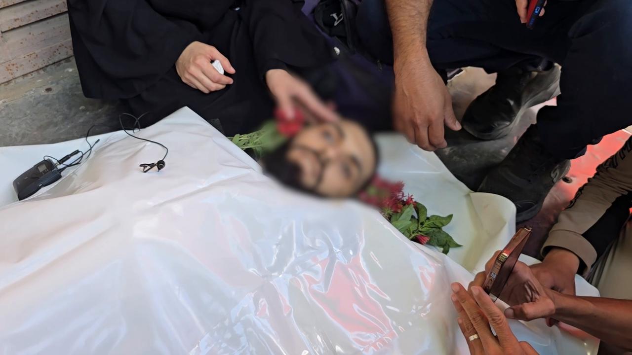 Video thumbnail for Relatives bid farewell to journalist killed in Israeli attack on Gaza.