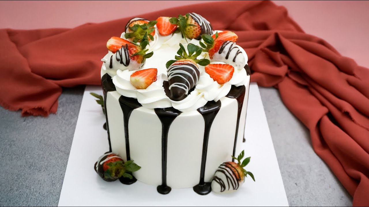 Video thumbnail for Dark chocolate flow over cake decoration with strawberries and flowers for birthday