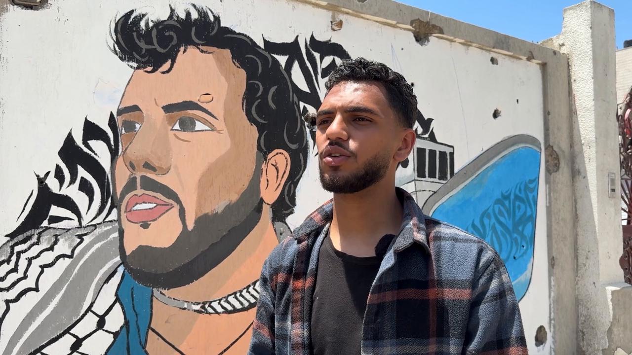 Video thumbnail for Gaza artist paints portrait of detained aid flotilla activist Thiago Avila.