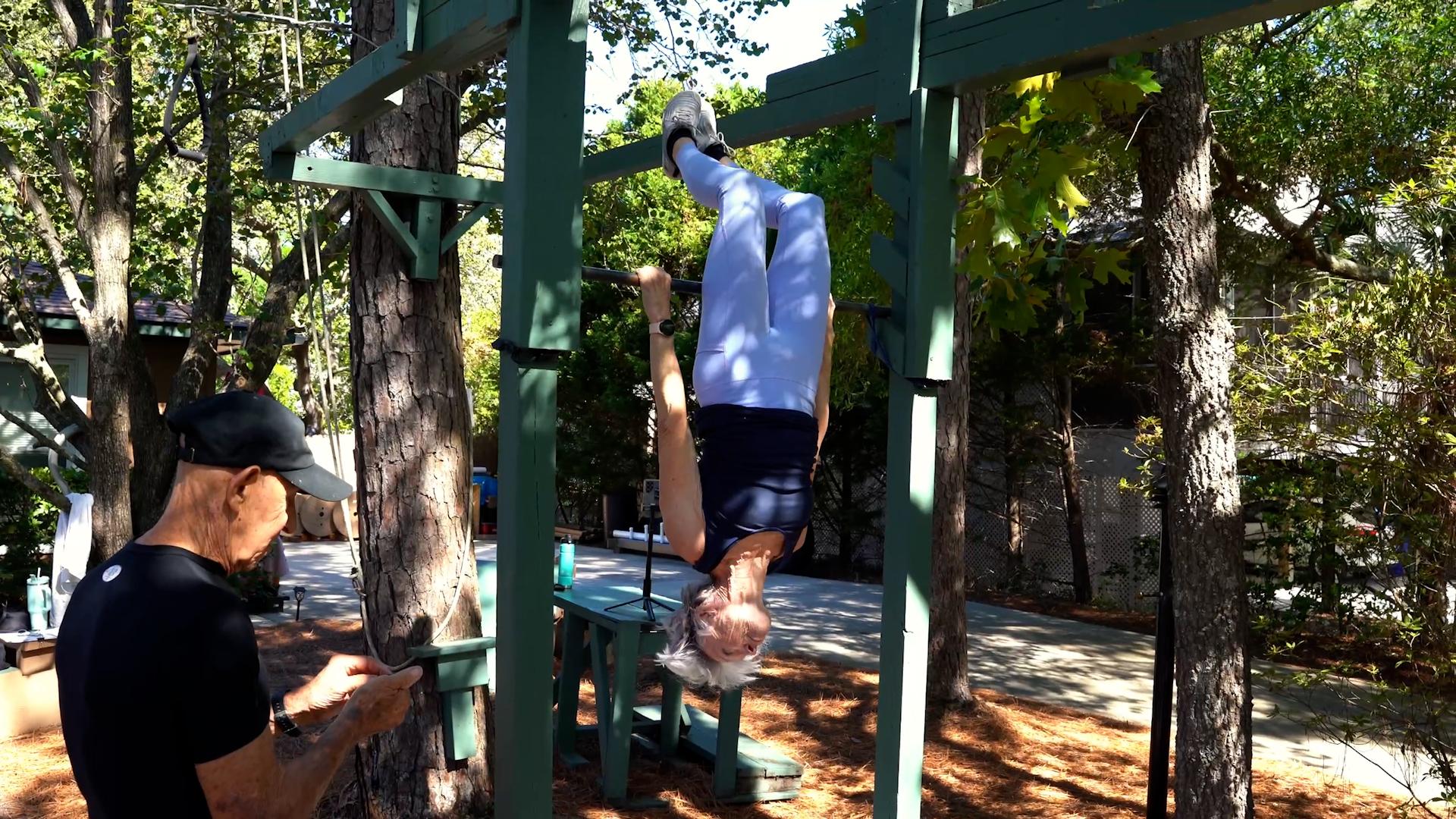 Video thumbnail for Oldest person to perform an inverted bar hang (female) - Ginny MacColl at 74 years and 196 days old