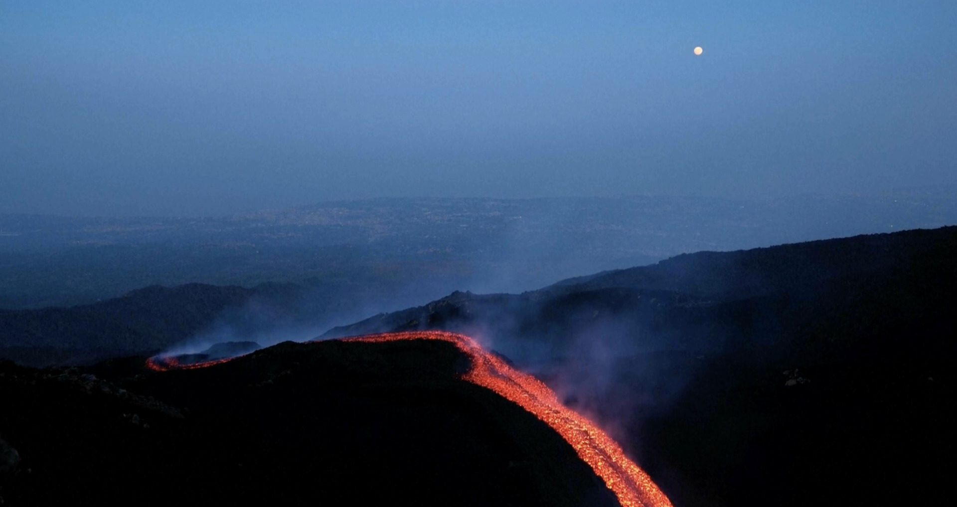 Video thumbnail for Orange lava flows stream from Mount Etna