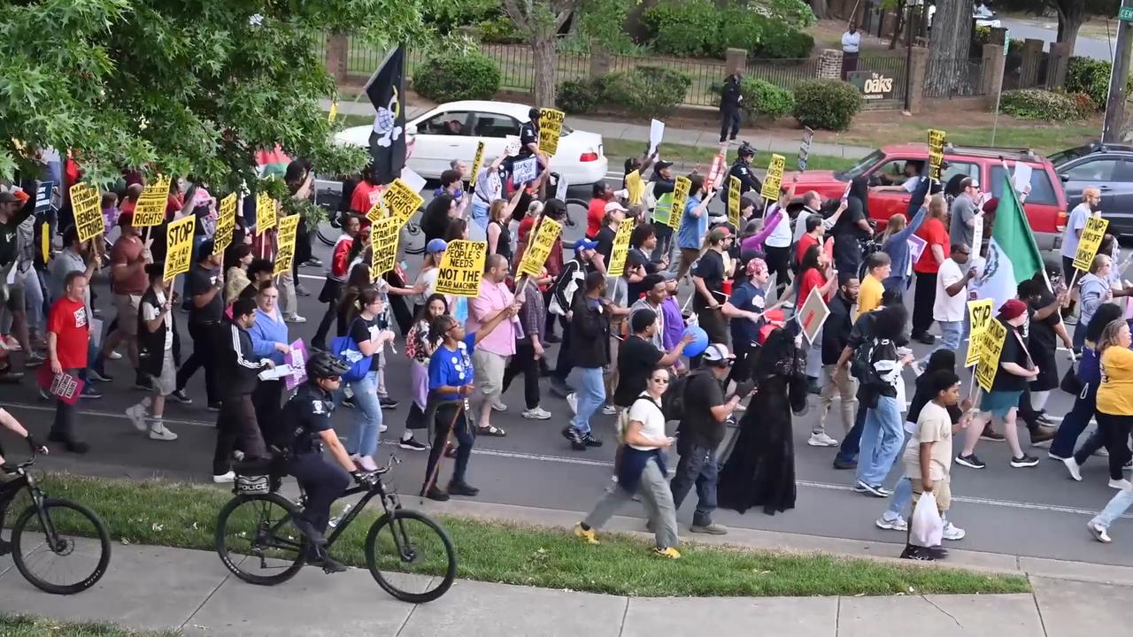 Video thumbnail for US: Hundreds rally in Charlotte for workers’ rights, block streets in May Day protest.