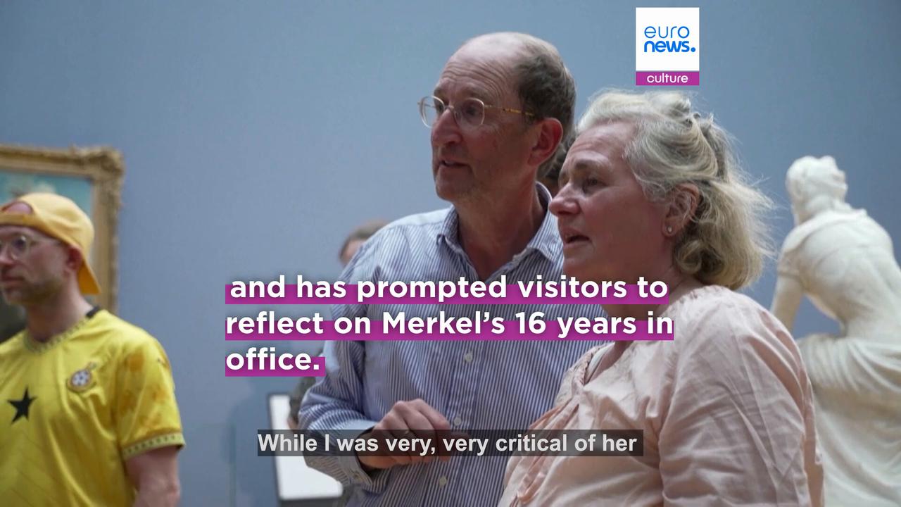 Video thumbnail for Hundreds of nostalgic Germans flock to see Angela Merkel’s portrait