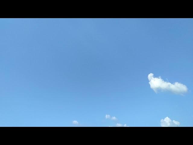 Video thumbnail for Blue sky white scattering moving clouds time lapse short video clip.