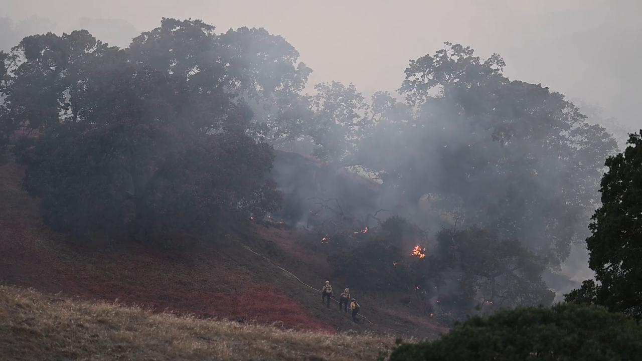 Video thumbnail for US: Firefighters battle 'Little Fire' in California as helicopters support ground operations.