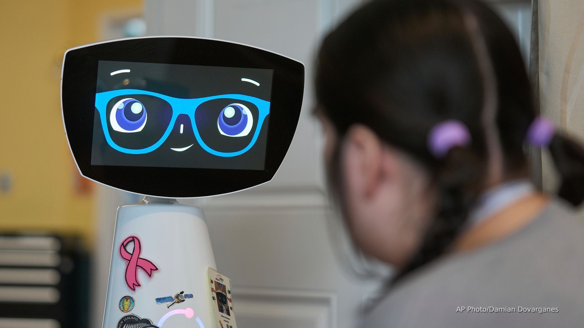 'Video thumbnail for Meet Robin: An AI robot designed to imitate a 7-year-old comforts hospital patients'