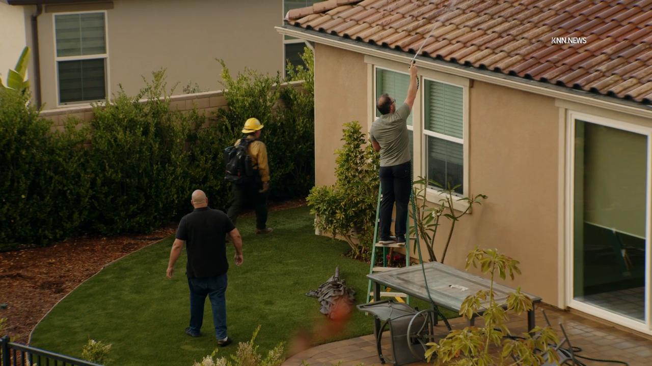 Video thumbnail for US, Los Angeles: Simi Valley Sandy Wildfire Day 2 Man Waters Home Fire Nears Part 2.