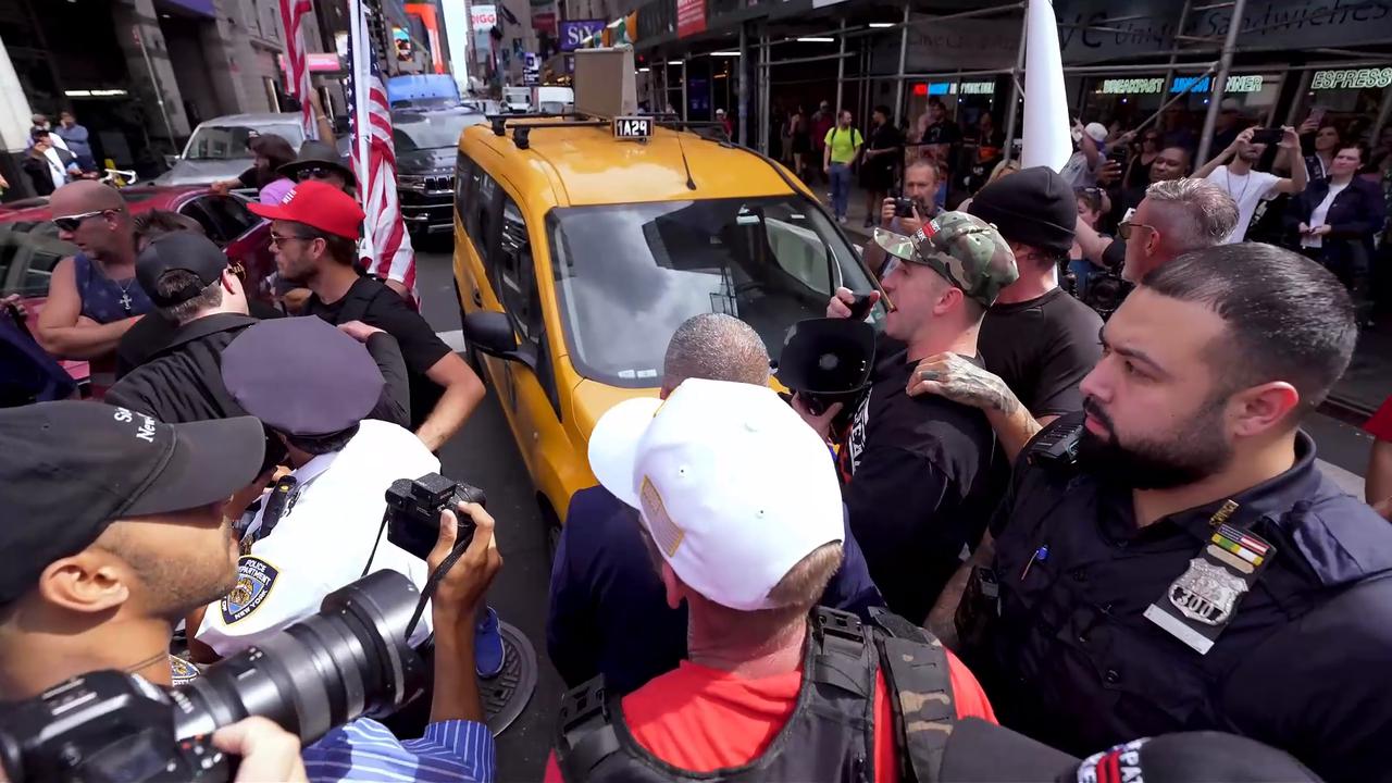 Video thumbnail for US: NYC: Charlie Kirk statue unveiling sparks clashes in Times Square on assassination anniversary.