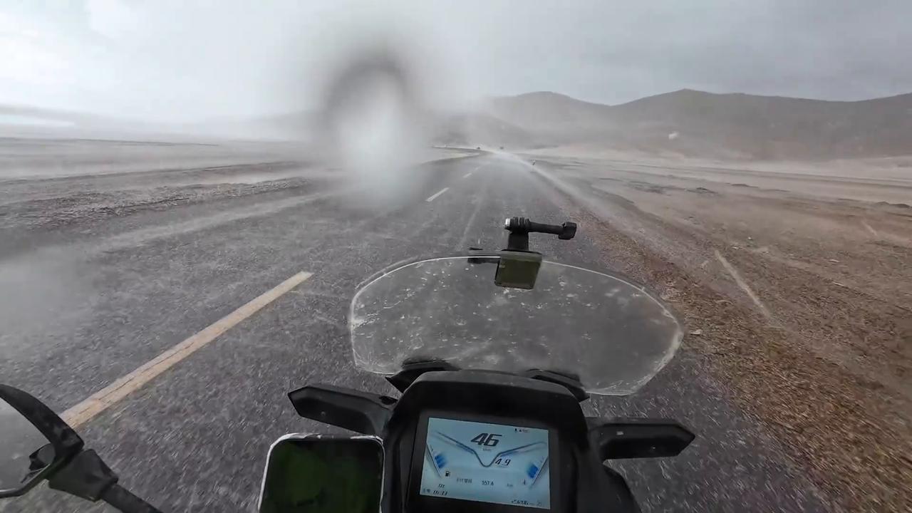 Video thumbnail for China: Motorcyclist braves a sudden hailstorm on Highway 219.
