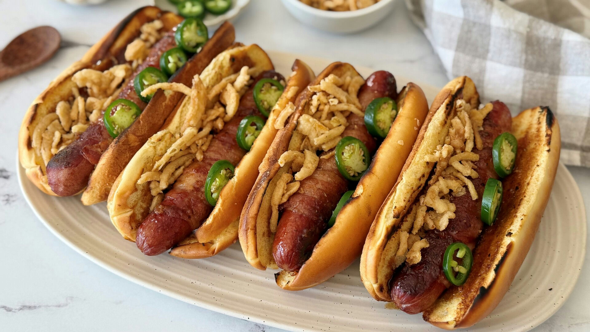 Video thumbnail for These Bacon-Wrapped Hot Dogs Bring Sweet, Smoky, And Spicy Flavor To The Grill