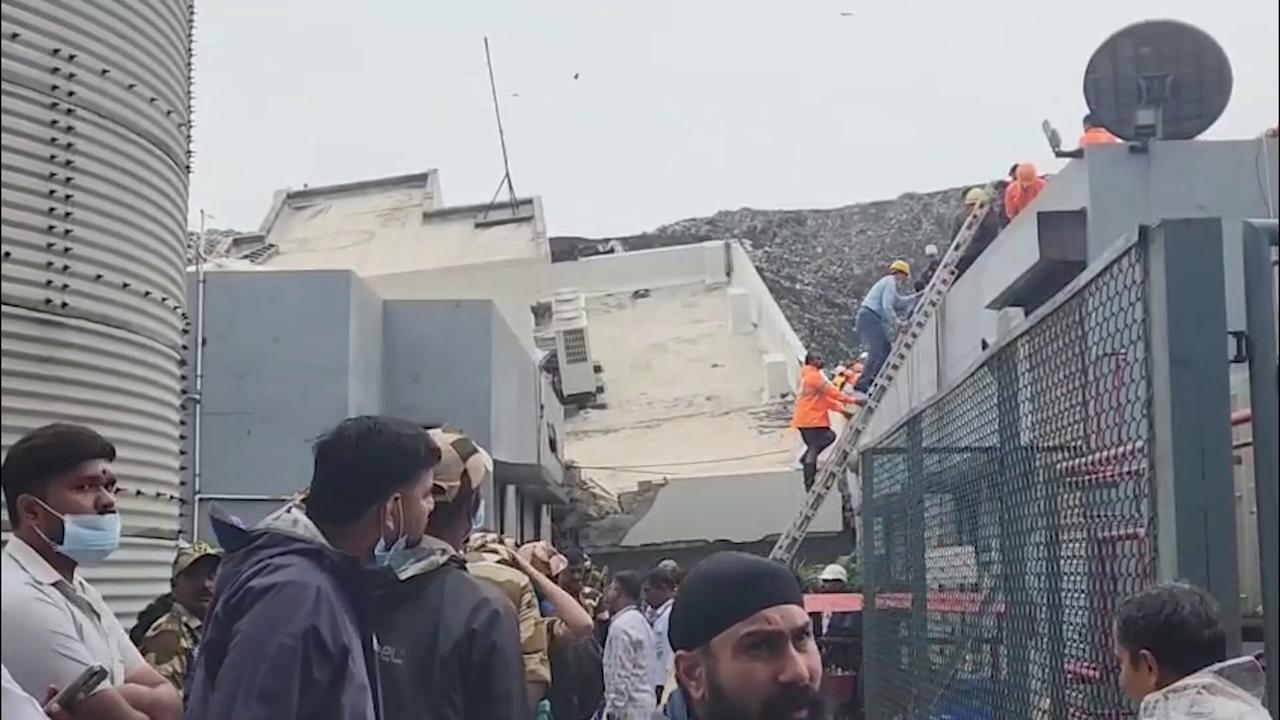 Video thumbnail for India: 16 feared trapped as waste mound crashes onto building in India's Maharashtra.