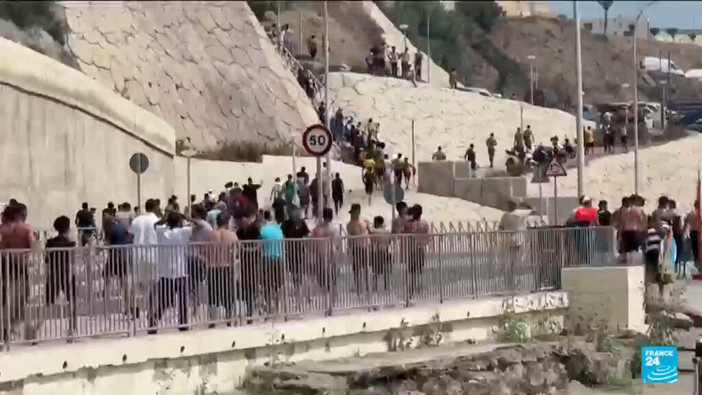 Video thumbnail for Ceuta: 60,000 cross the border, 57 died
