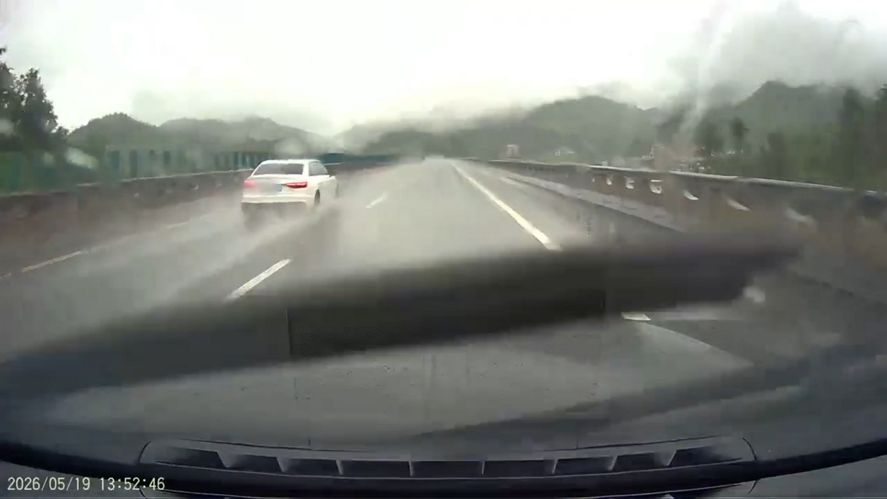 Video thumbnail for Car Spins Out on Rainy Hunan Highway