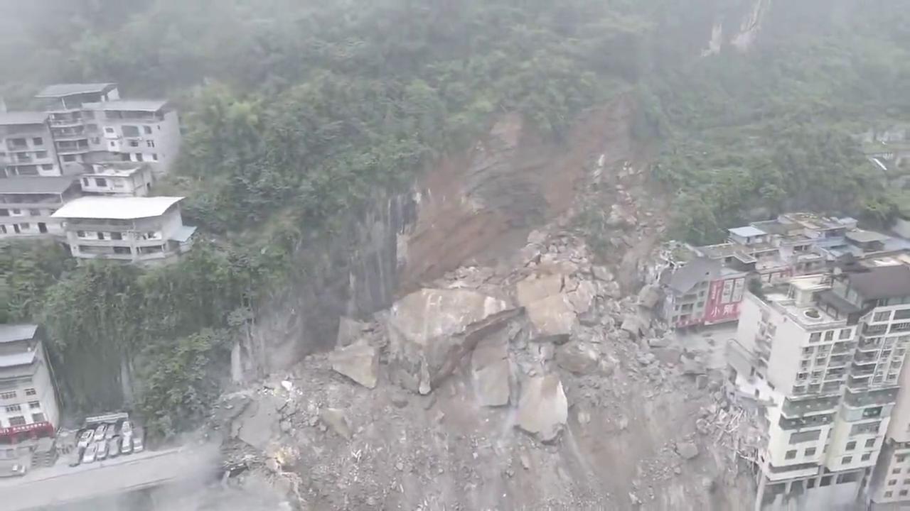 Video thumbnail for China: Landslide buries houses, traps people in southwest China's Chongqing.